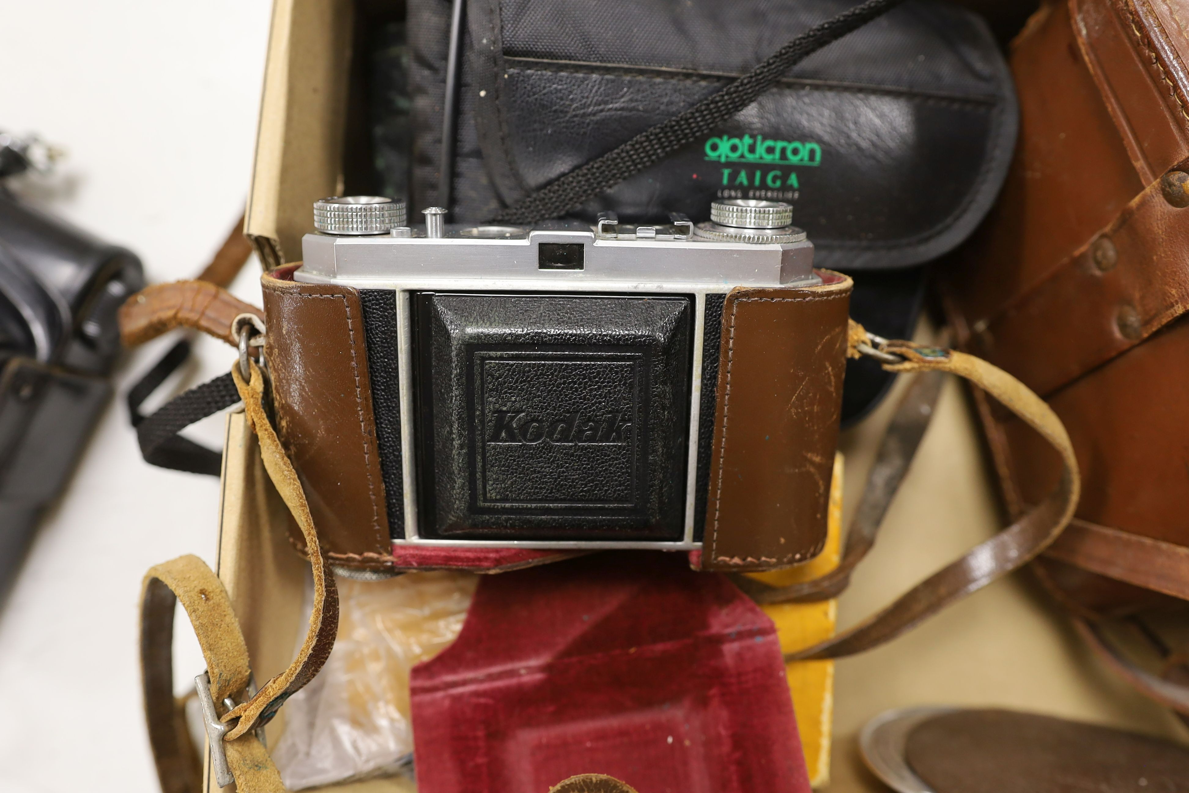 A pair of Taiga binoculars, various cameras etc.